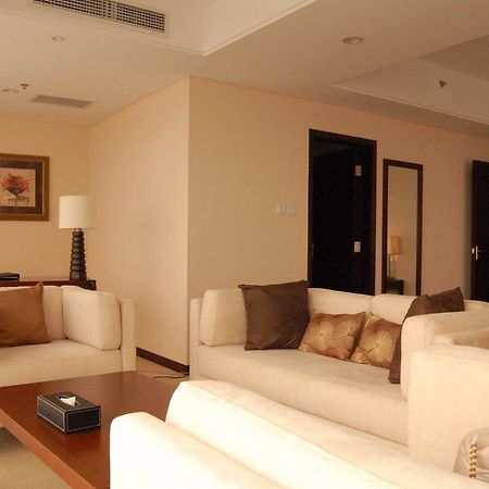 Joy City Hotel & Apartment Pequim Quarto foto